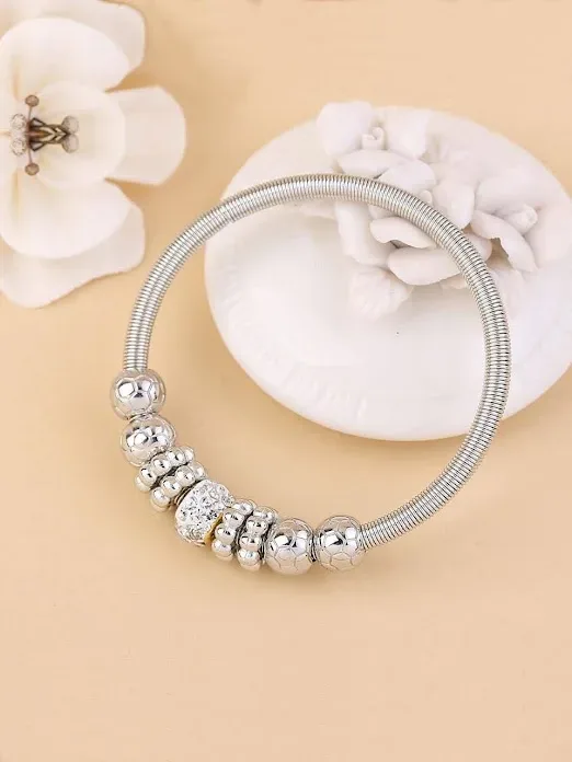 Pulsera de fantasía para dama color plateado con accesorios